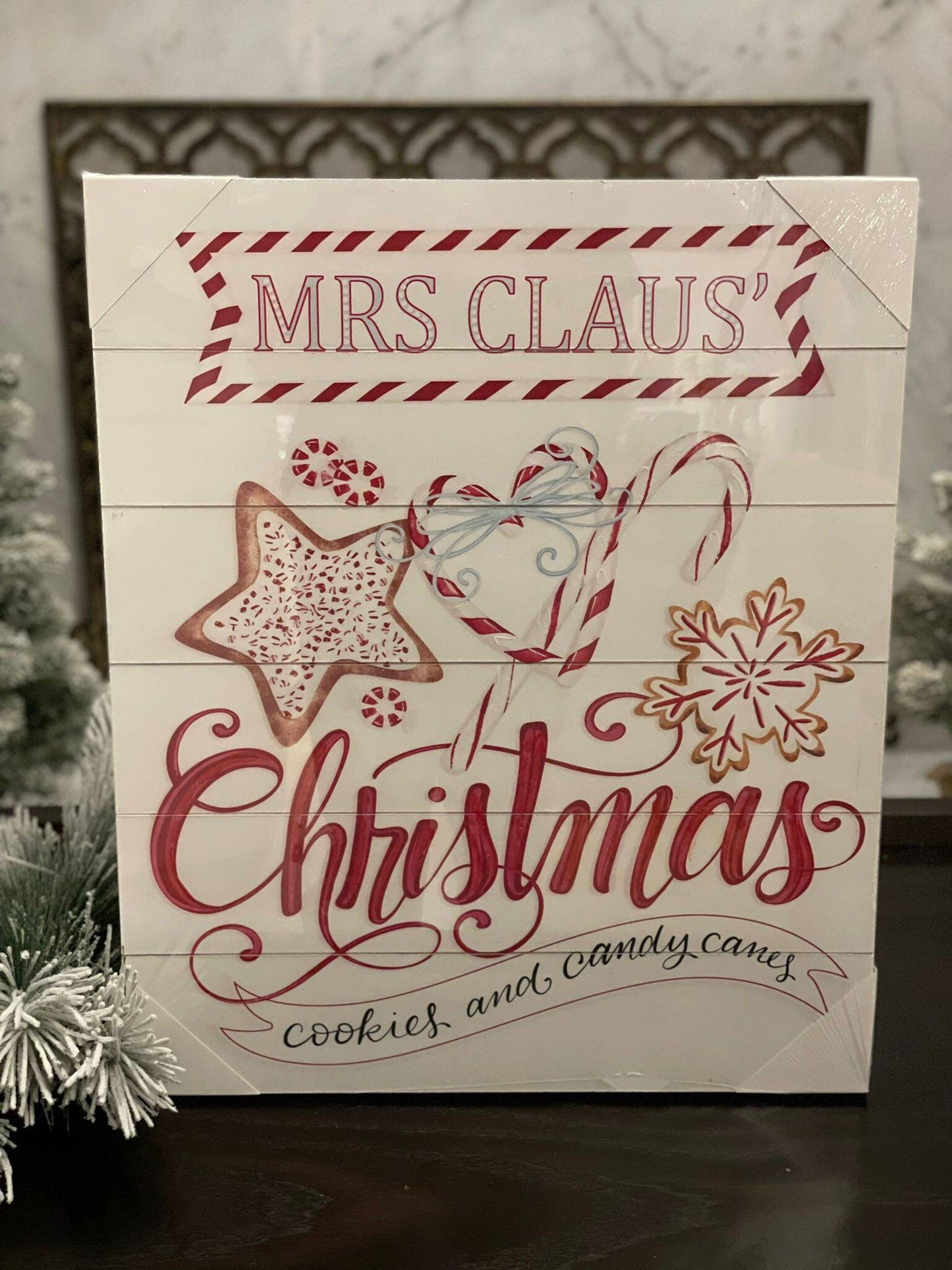 23.75" Mrs. Claus cookies wood looking wall art.