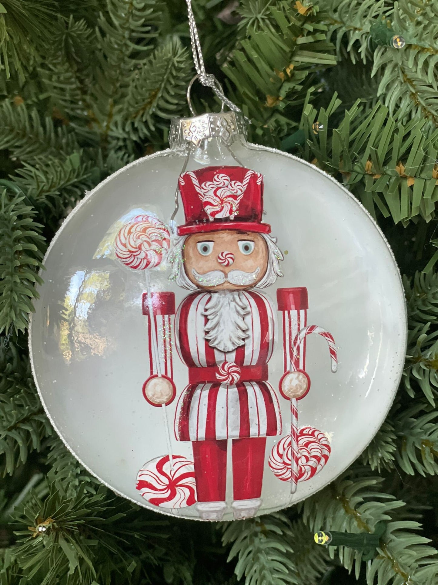 4" Glass candy nutcracker disc ornament.*