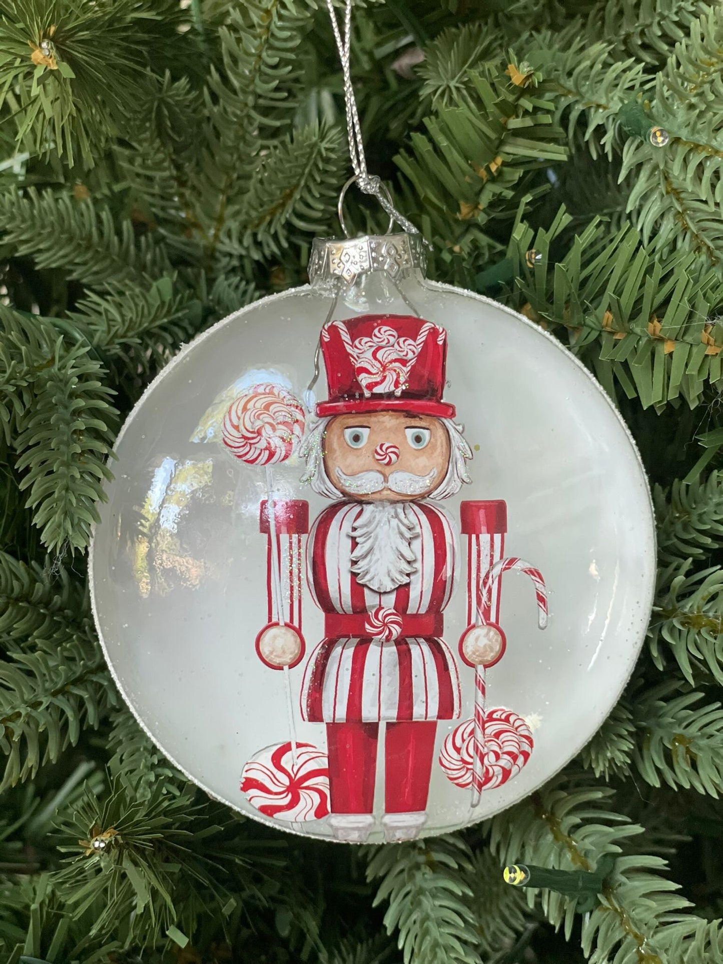 4" Glass candy nutcracker disc ornament.*