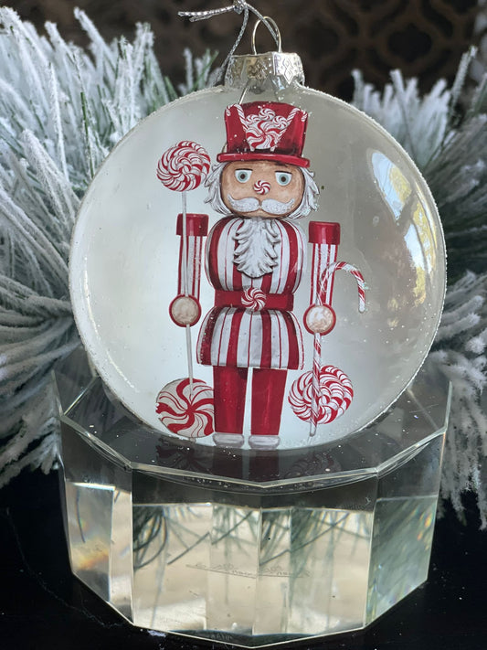 4" Glass candy nutcracker disc ornament.*