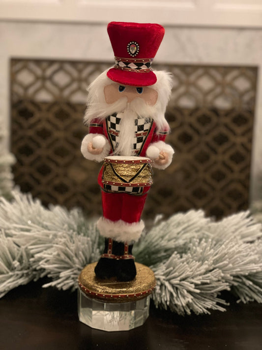 16” Nutcracker in red velvet with a checkered pattern band in his hat that matches his jacket