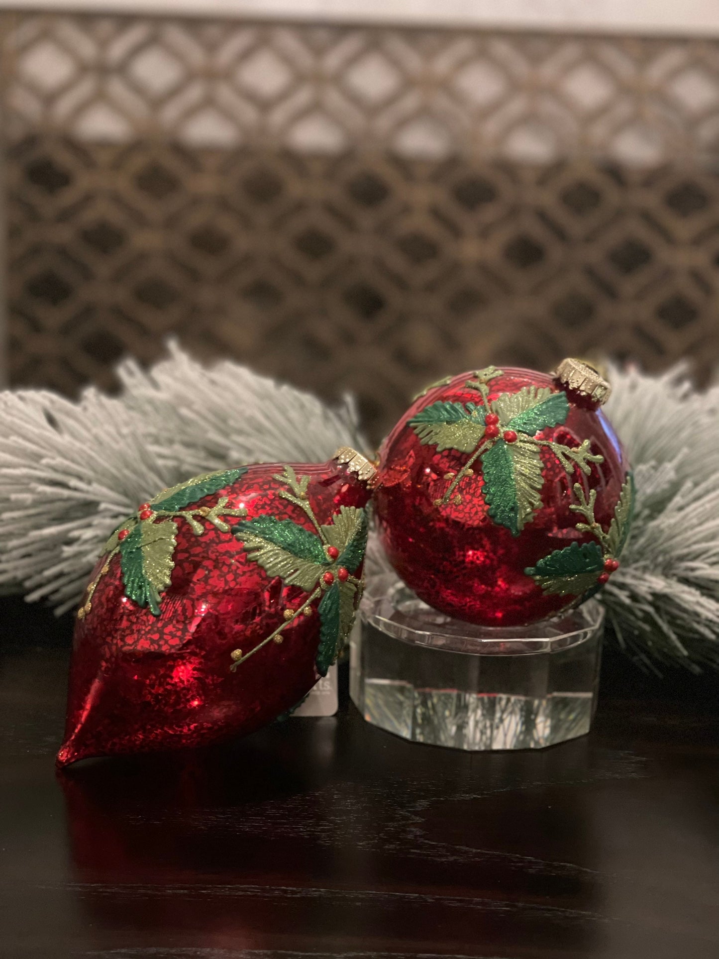 7" Holly patterned glass ornament.