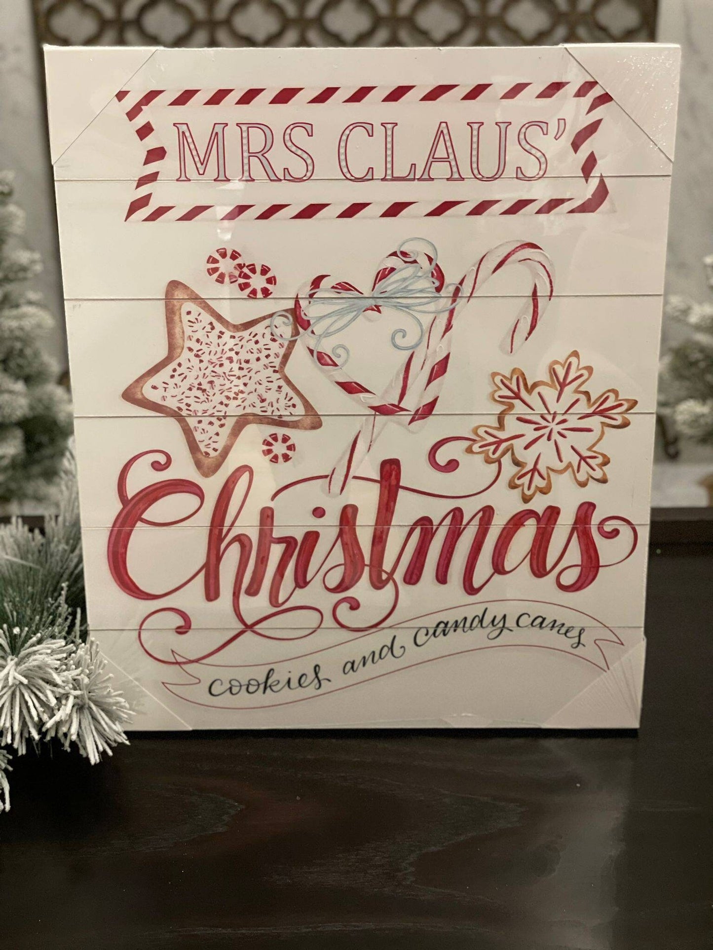 23.75" Mrs. Claus cookies wood looking wall art.