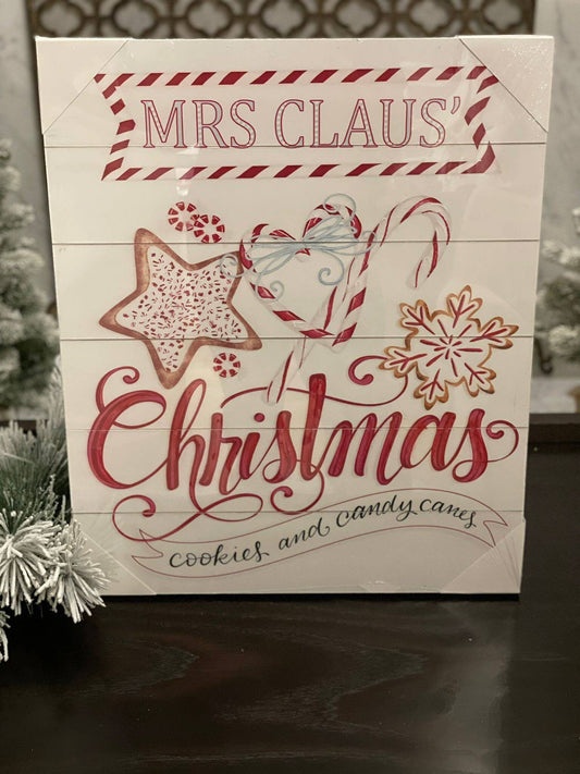 23.75" Mrs. Claus cookies wood looking wall art.