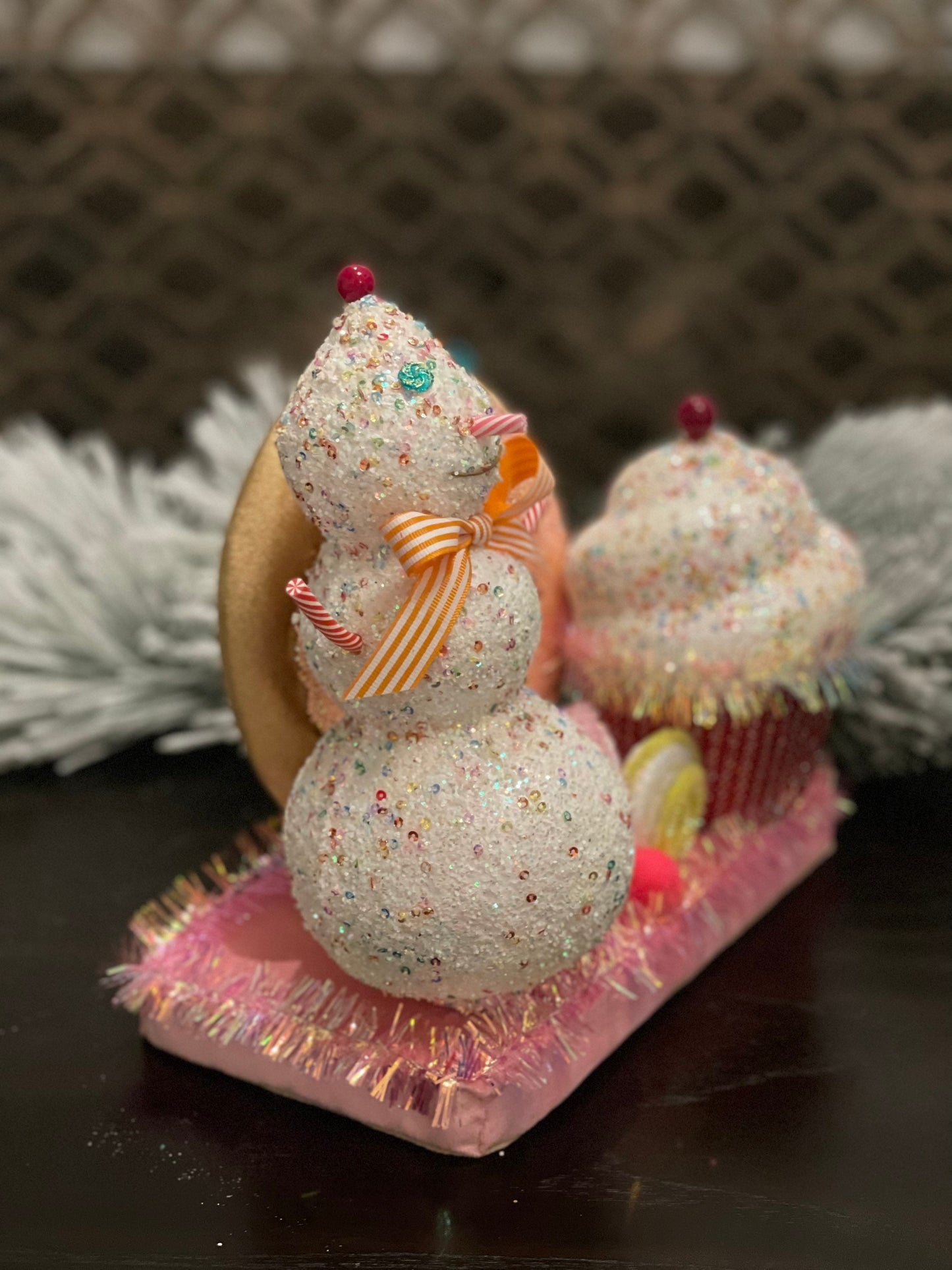 11” l x 10”h x 5.5” w. Snowman donut and cupcake scene.