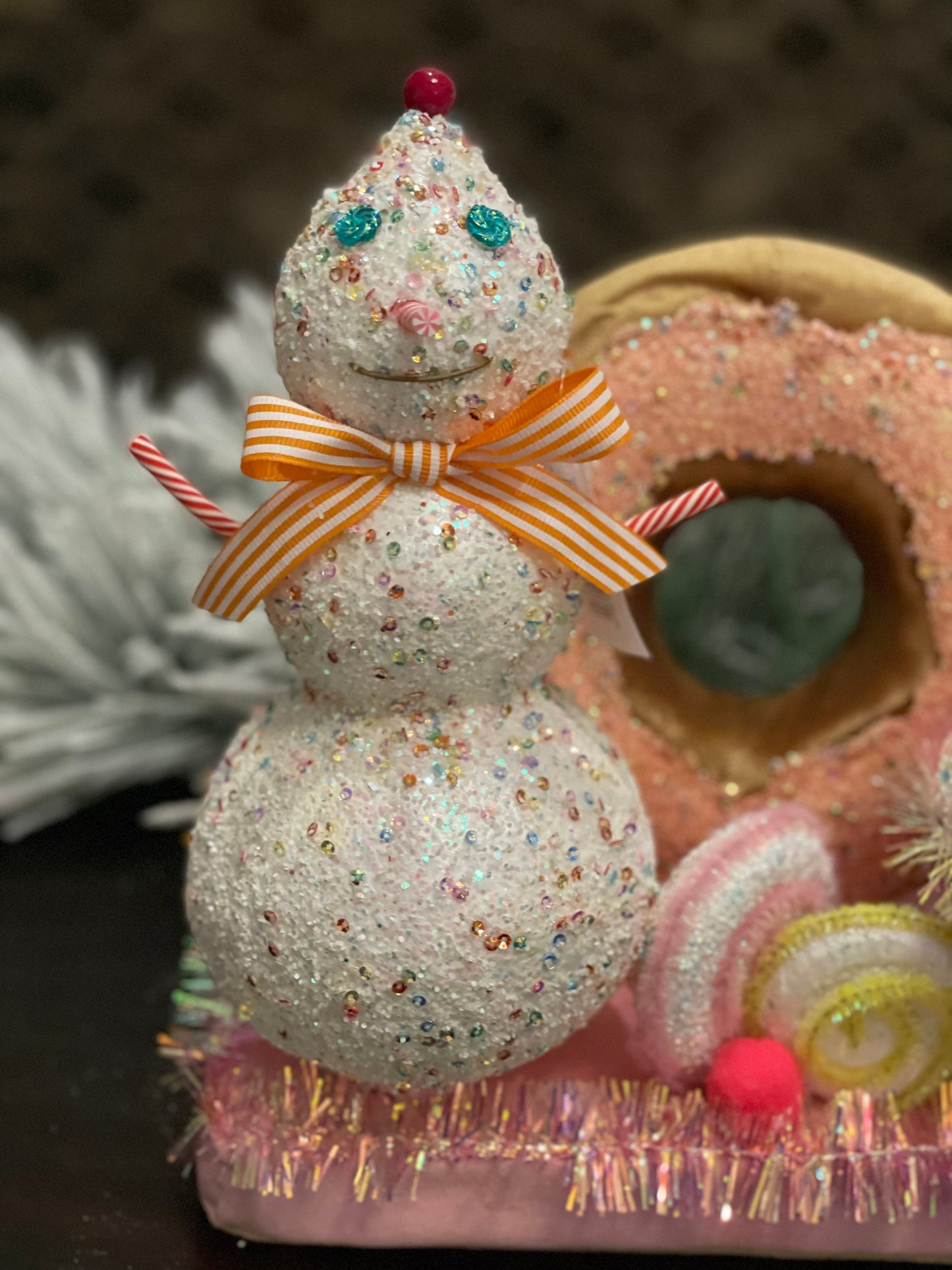 11” l x 10”h x 5.5” w. Snowman donut and cupcake scene.