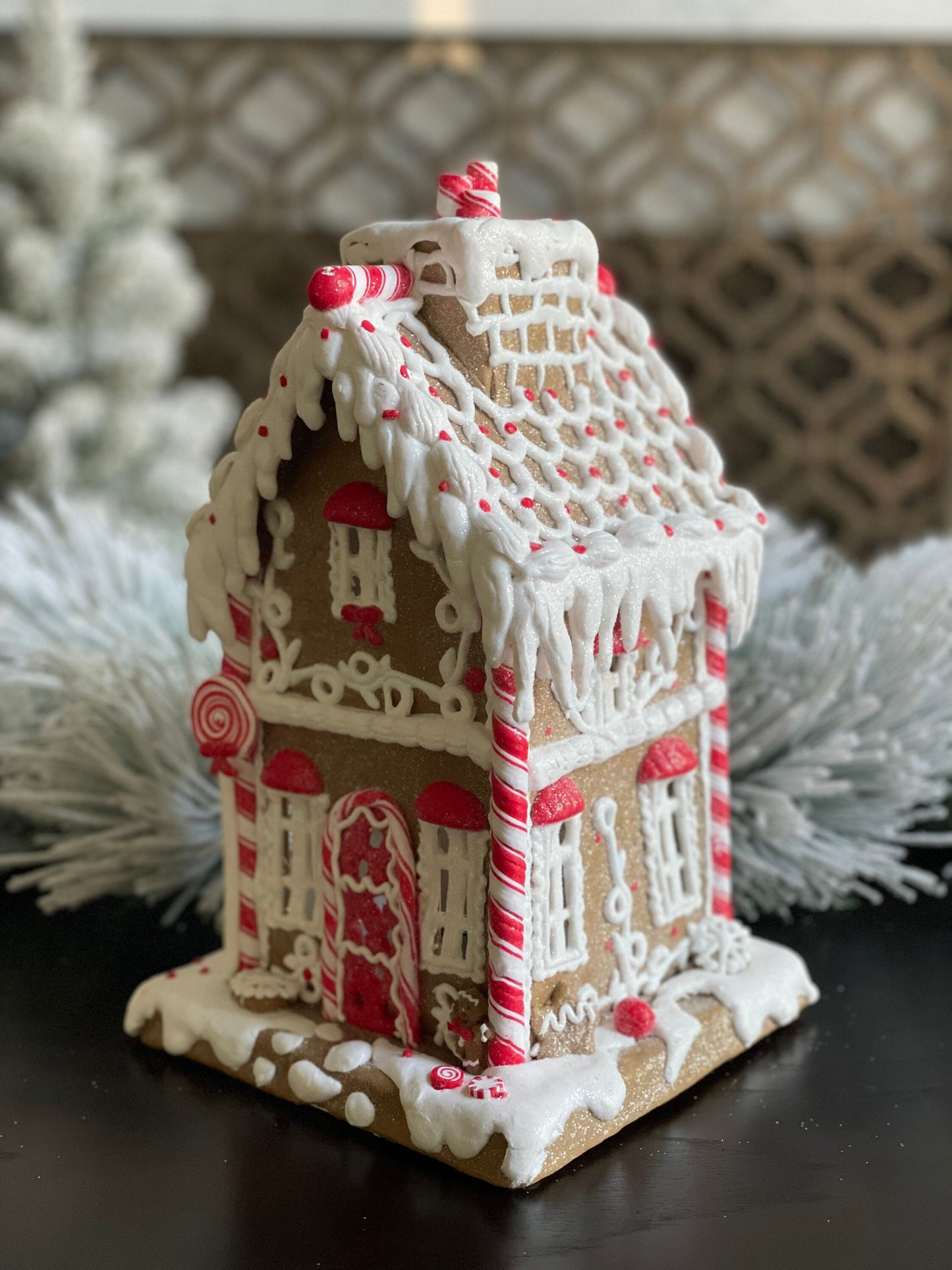 11.5”H x 6.5” W. Gingerbread lighted house with chimney. Red and white.