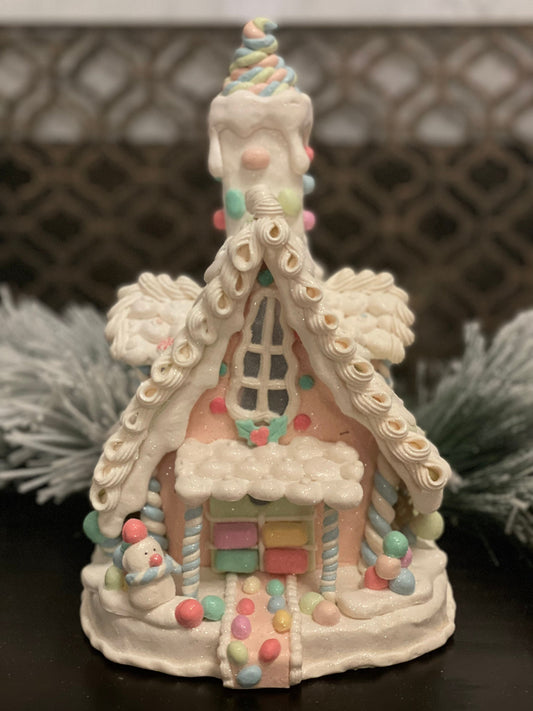 10”L x 13”H x 8.5 W Candy frosted house with snowman. Lighted. Pastel colors.