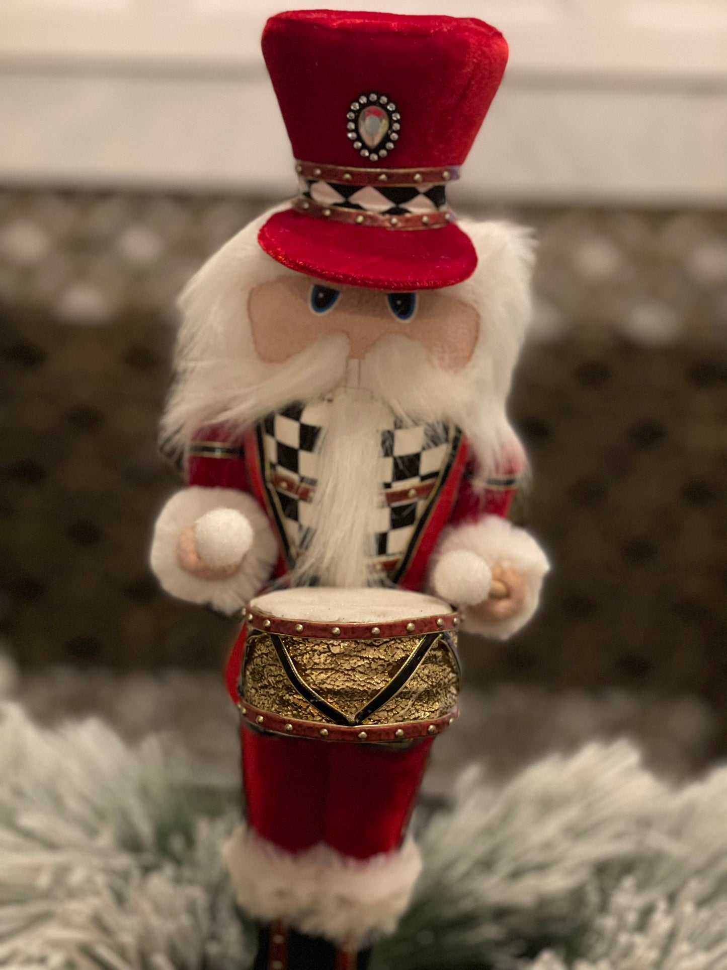 16” Nutcracker in red velvet with a checkered pattern band in his hat that matches his jacket