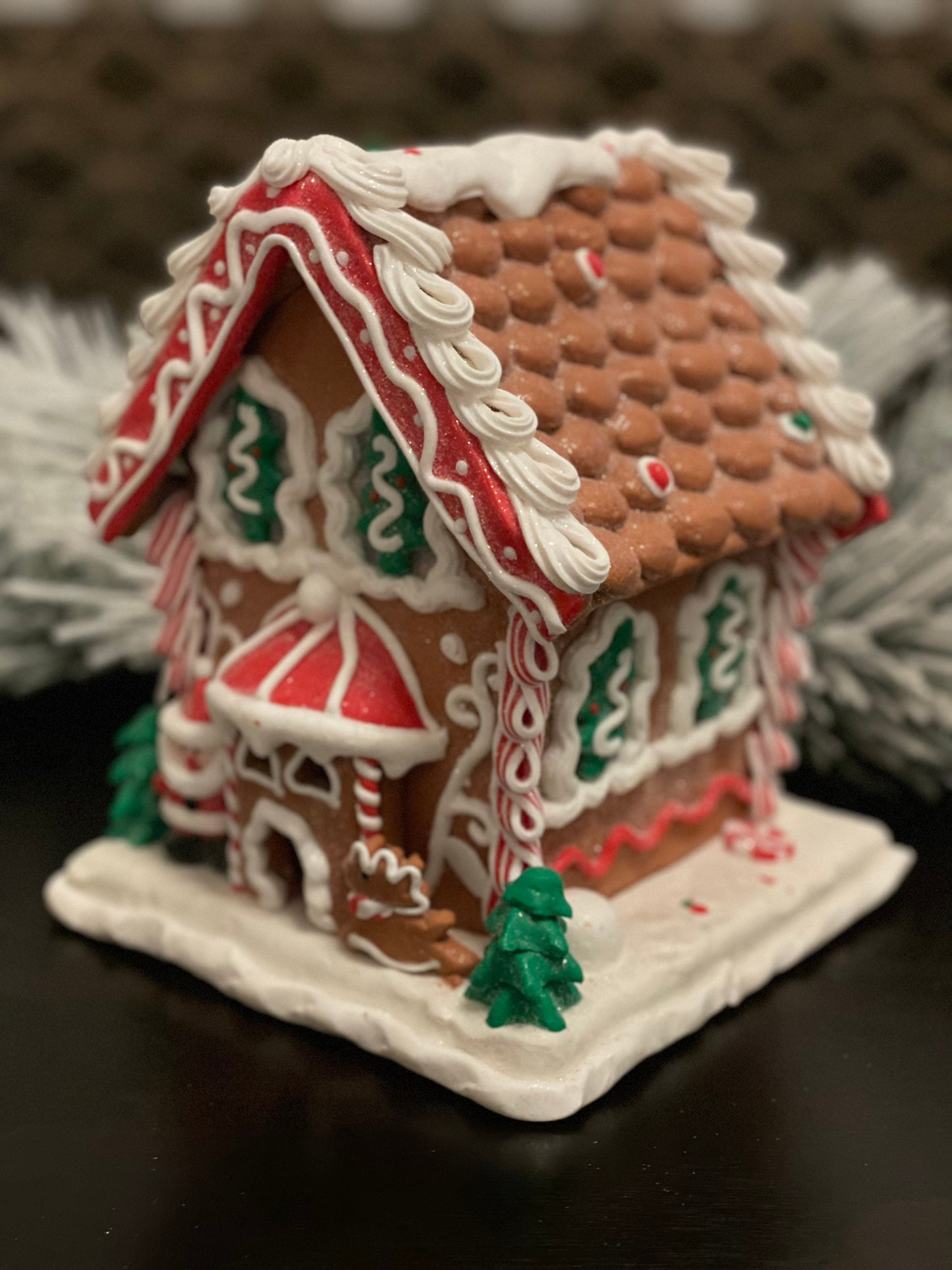 8.5”H x 7”W. Santa Gingerbread lighted house. Red, green and white.