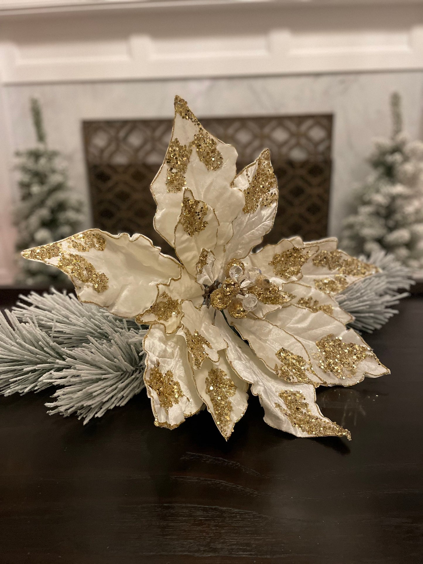 21”Extra large velvet Poinsettia with stem light ivory and gold. Sequins and glitter. Poinsettia measures 21” tip to tip. Stem is 14.5”.