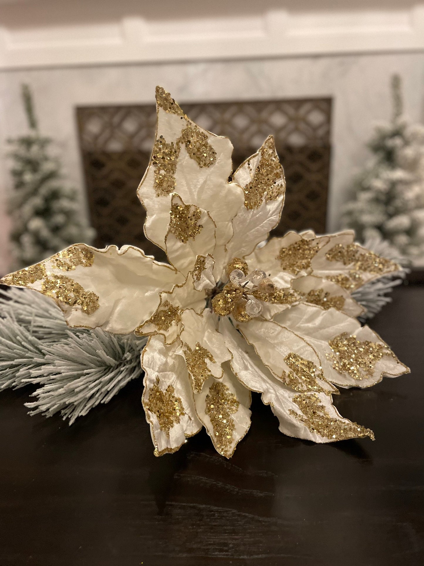 21”Extra large velvet Poinsettia with stem light ivory and gold. Sequins and glitter. Poinsettia measures 21” tip to tip. Stem is 14.5”.