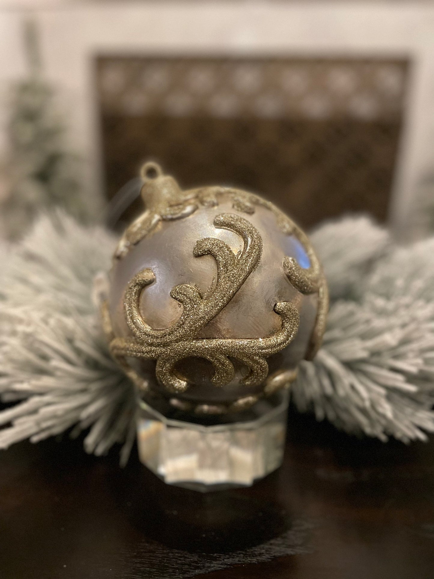 7” Vp. Ball embossed champagne with glitter.