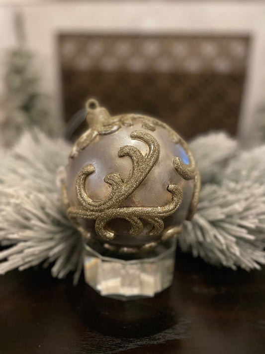 7” Vp. Ball embossed champagne with glitter.