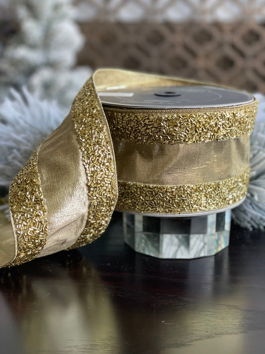 4"x10 yards tinsel borders gold.