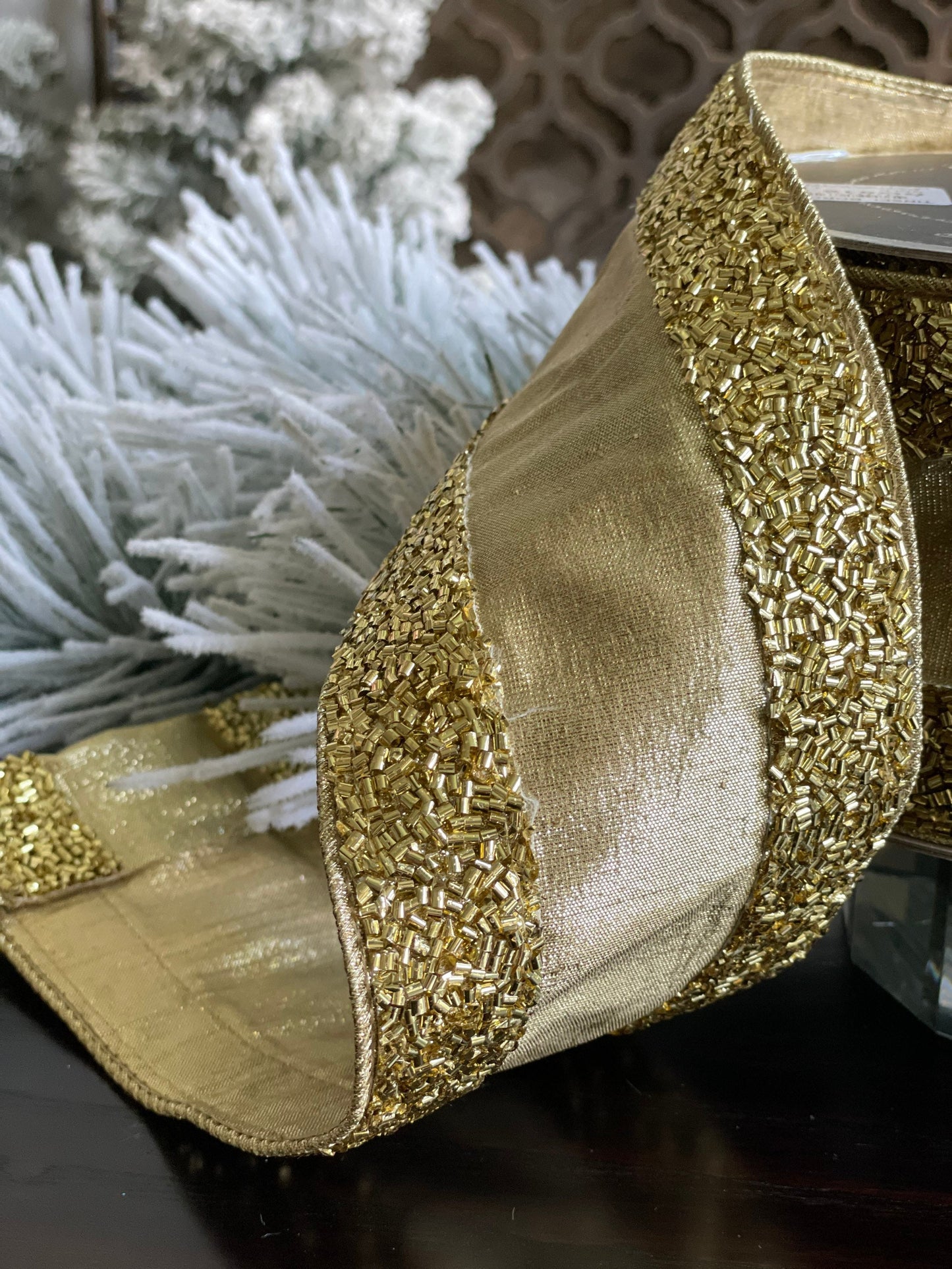 4"x10 yards tinsel borders gold.