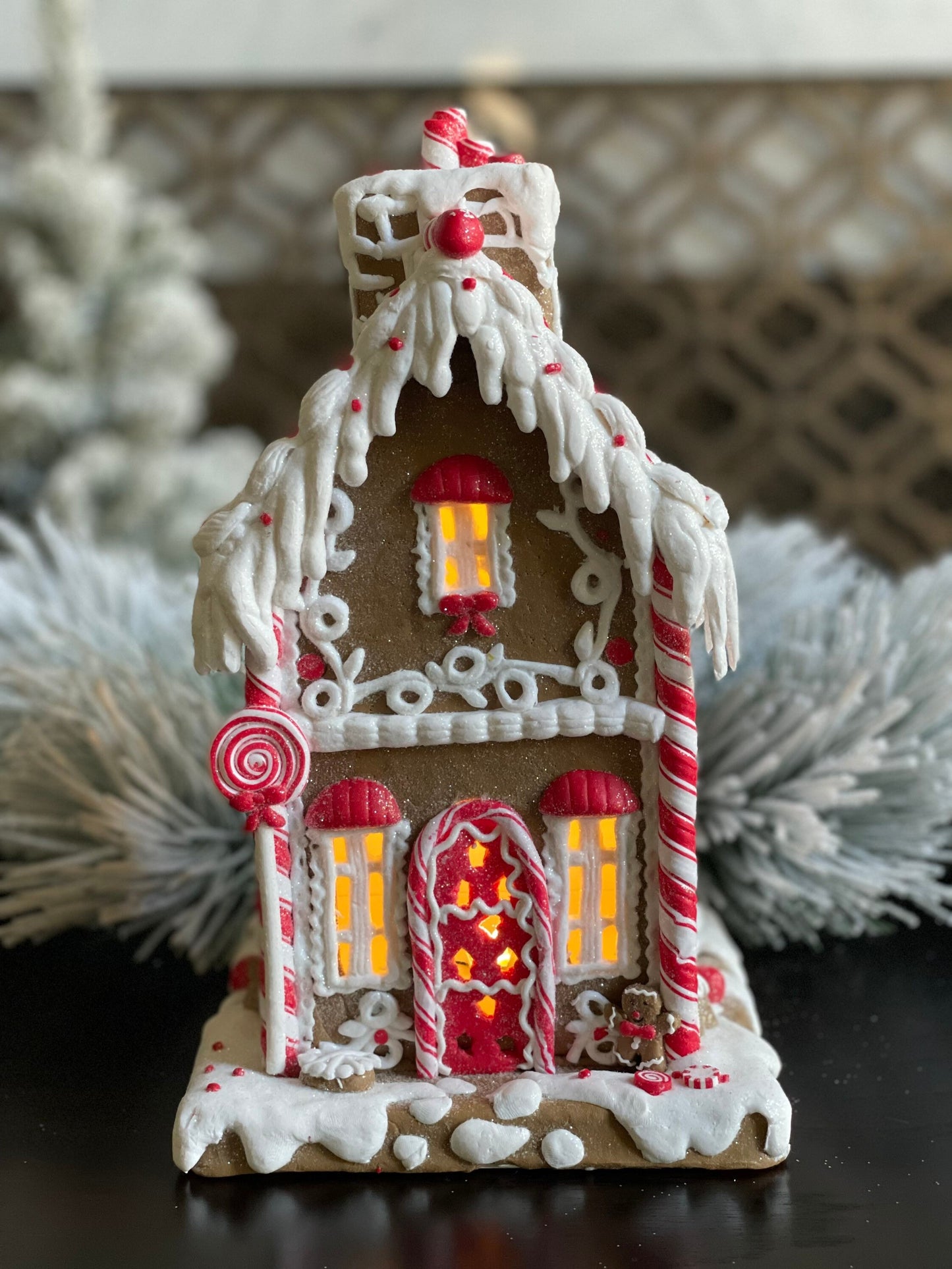 11.5”H x 6.5” W. Gingerbread lighted house with chimney. Red and white.
