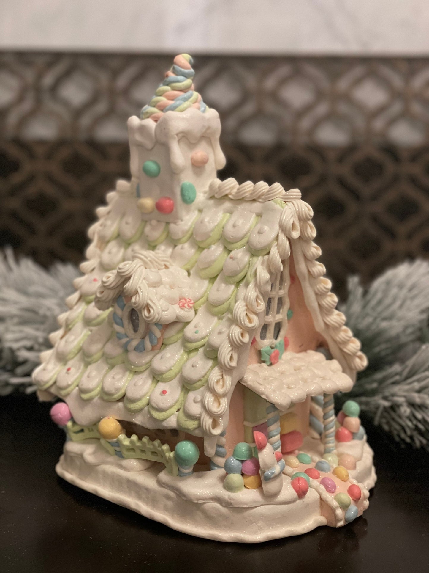 10”L x 13”H x 8.5 W Candy frosted house with snowman. Lighted. Pastel colors.