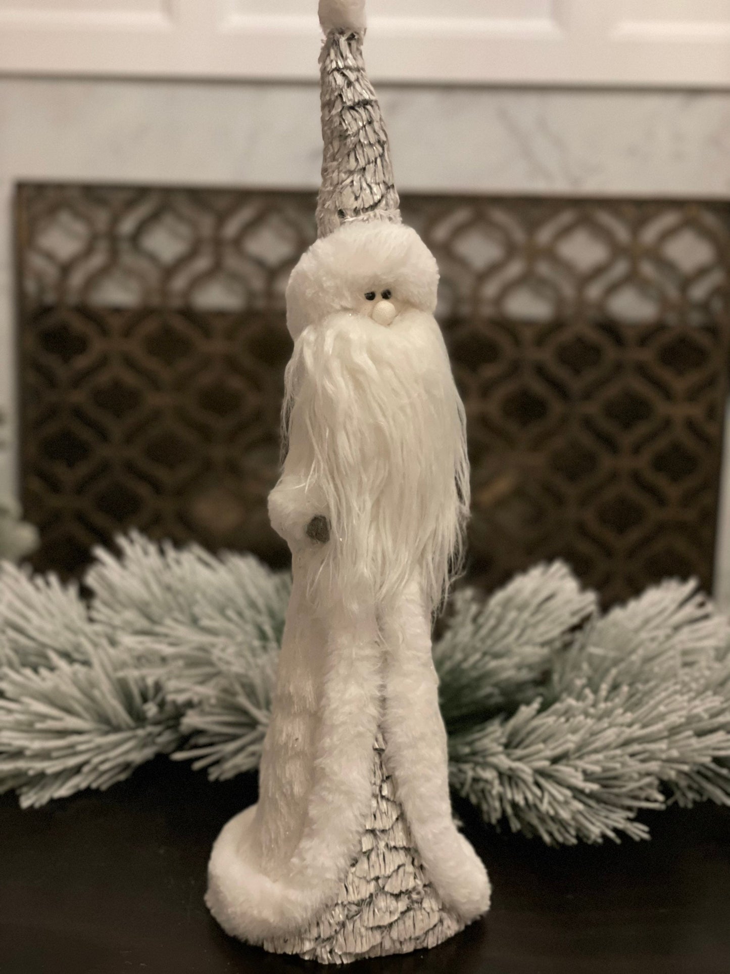 22"x7" frosted artic santa standing.