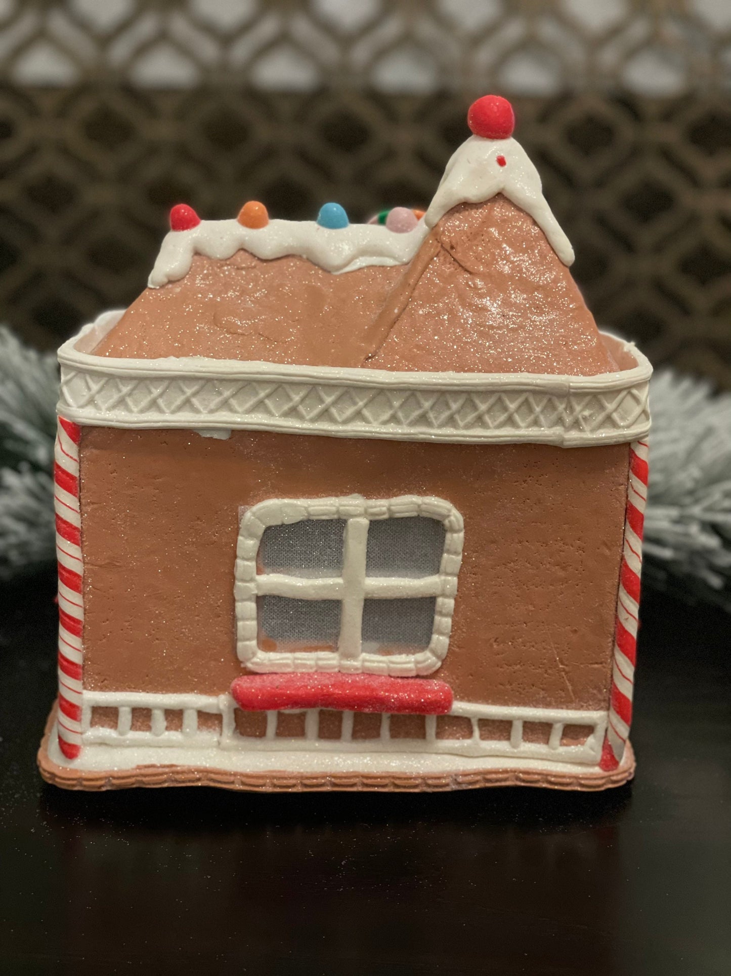 11”H x 10” L x 8”W. Candy Gingerbread store with snowman lighted.