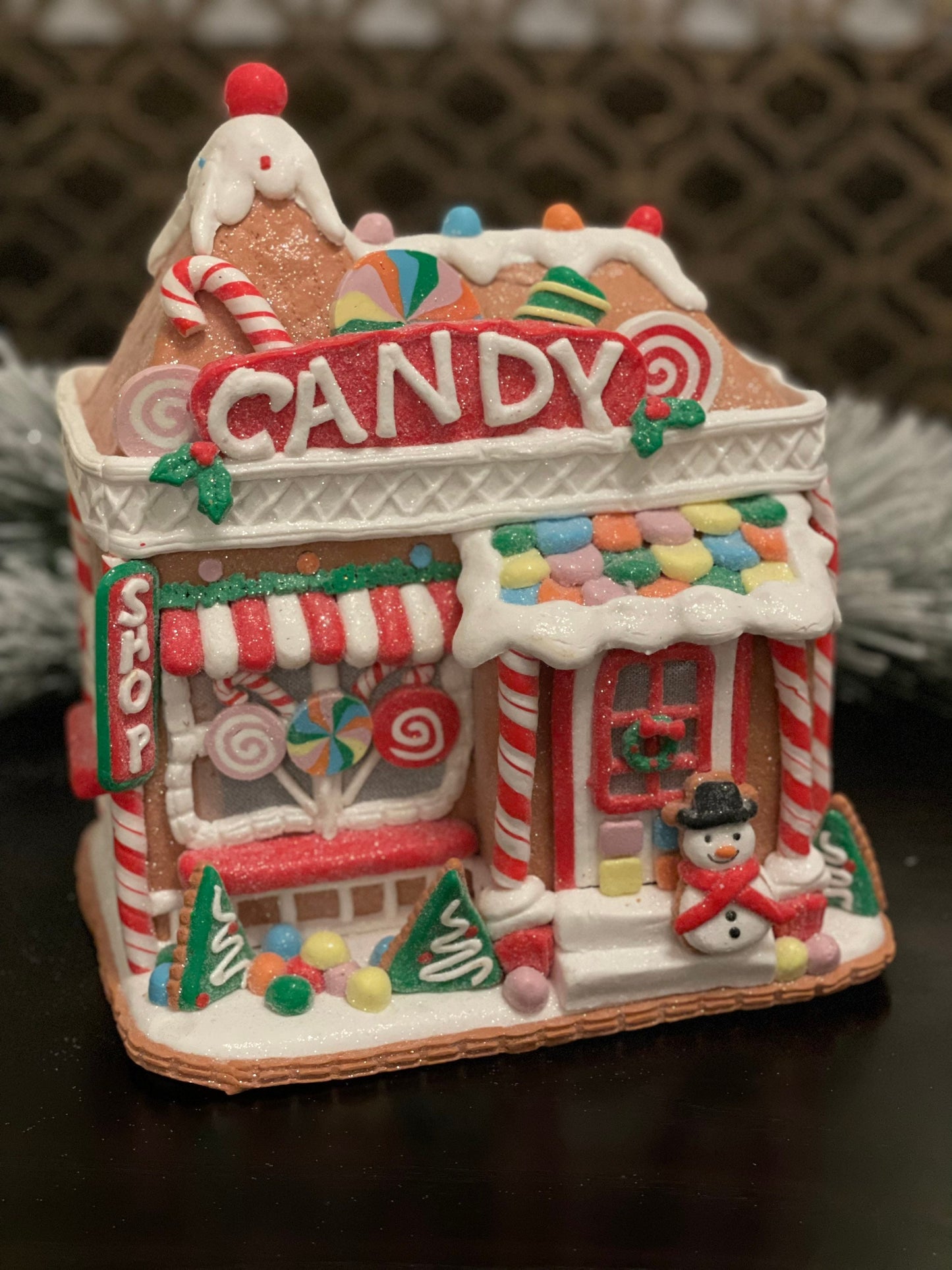 11”H x 10” L x 8”W. Candy Gingerbread store with snowman lighted.