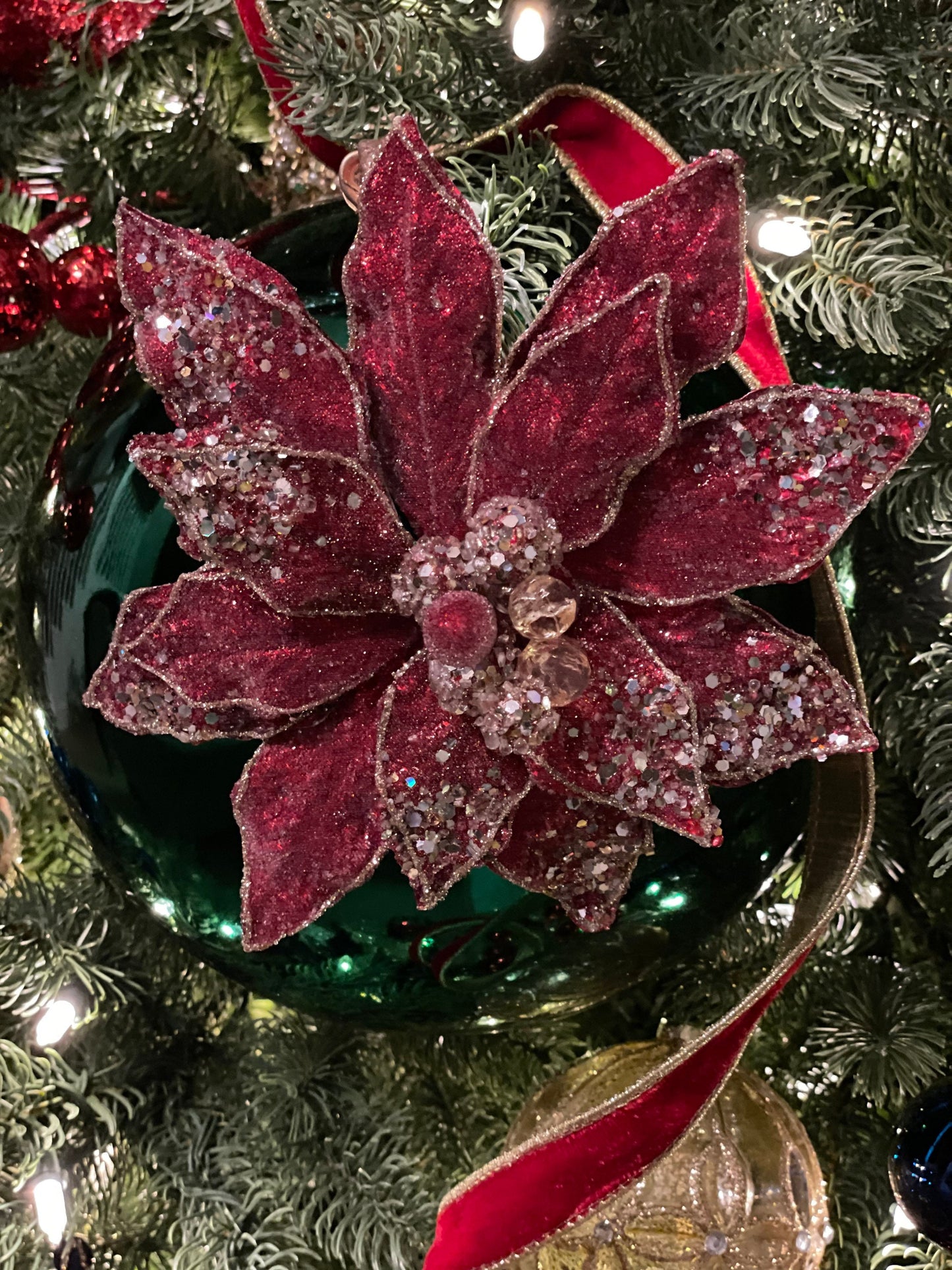 8” Red poinsettia beaded and metallic. red and soft gold. Clip poinsettia.