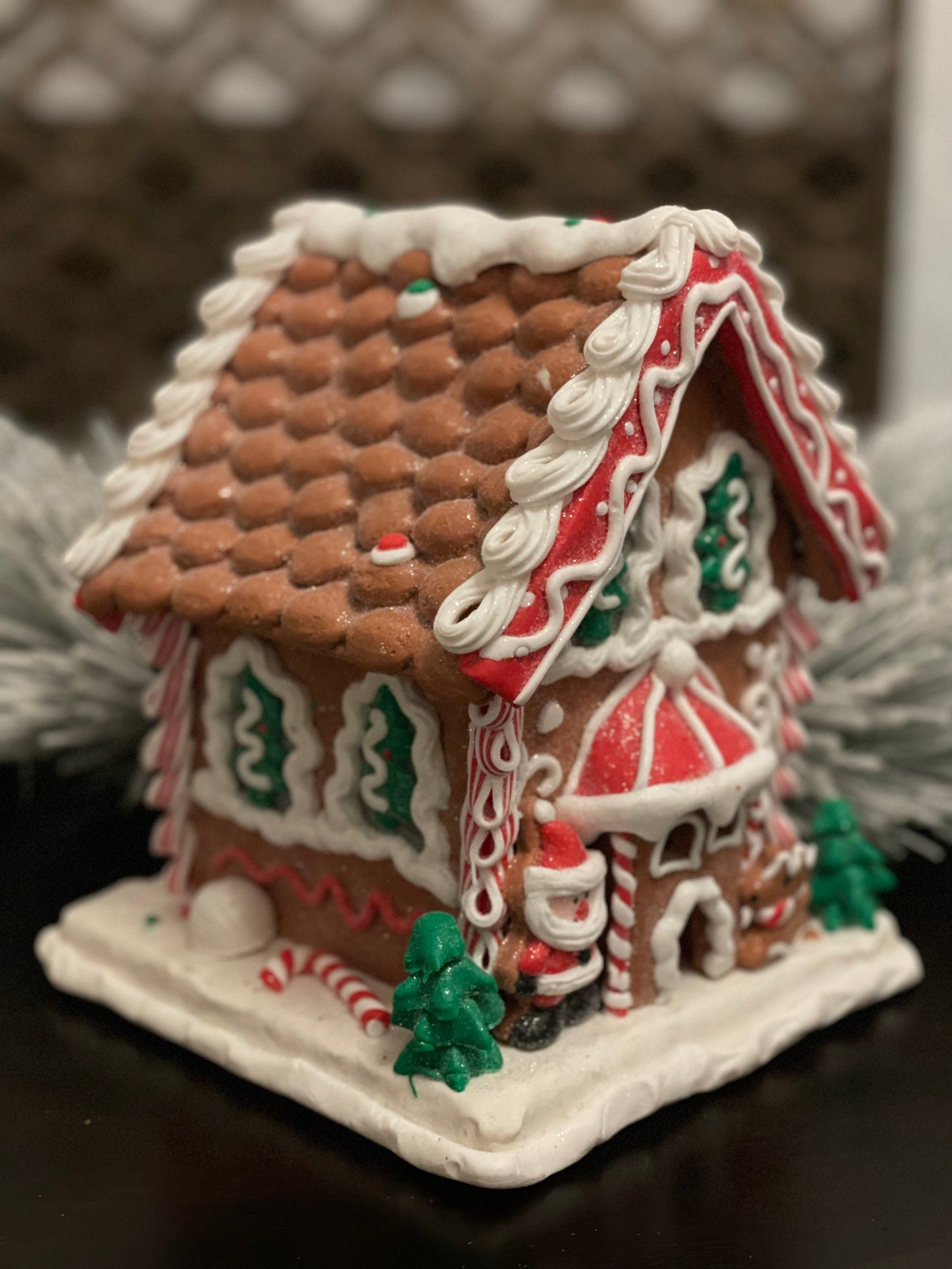 8.5”H x 7”W. Santa Gingerbread lighted house. Red, green and white.