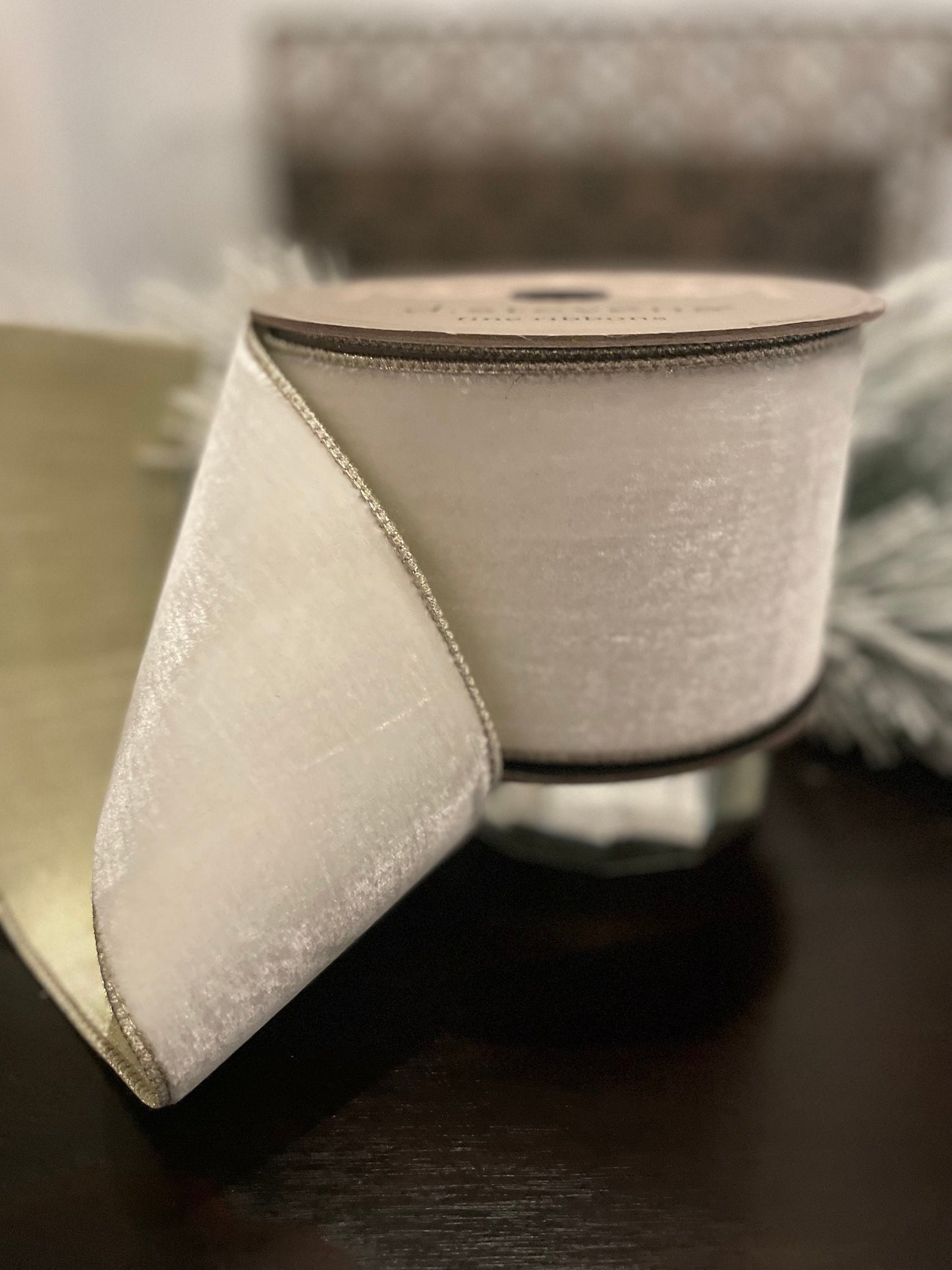 4” x 10 yds. Designer lush velvet winter white, metallic platinum back ribbon. Wired. D. Stevens.