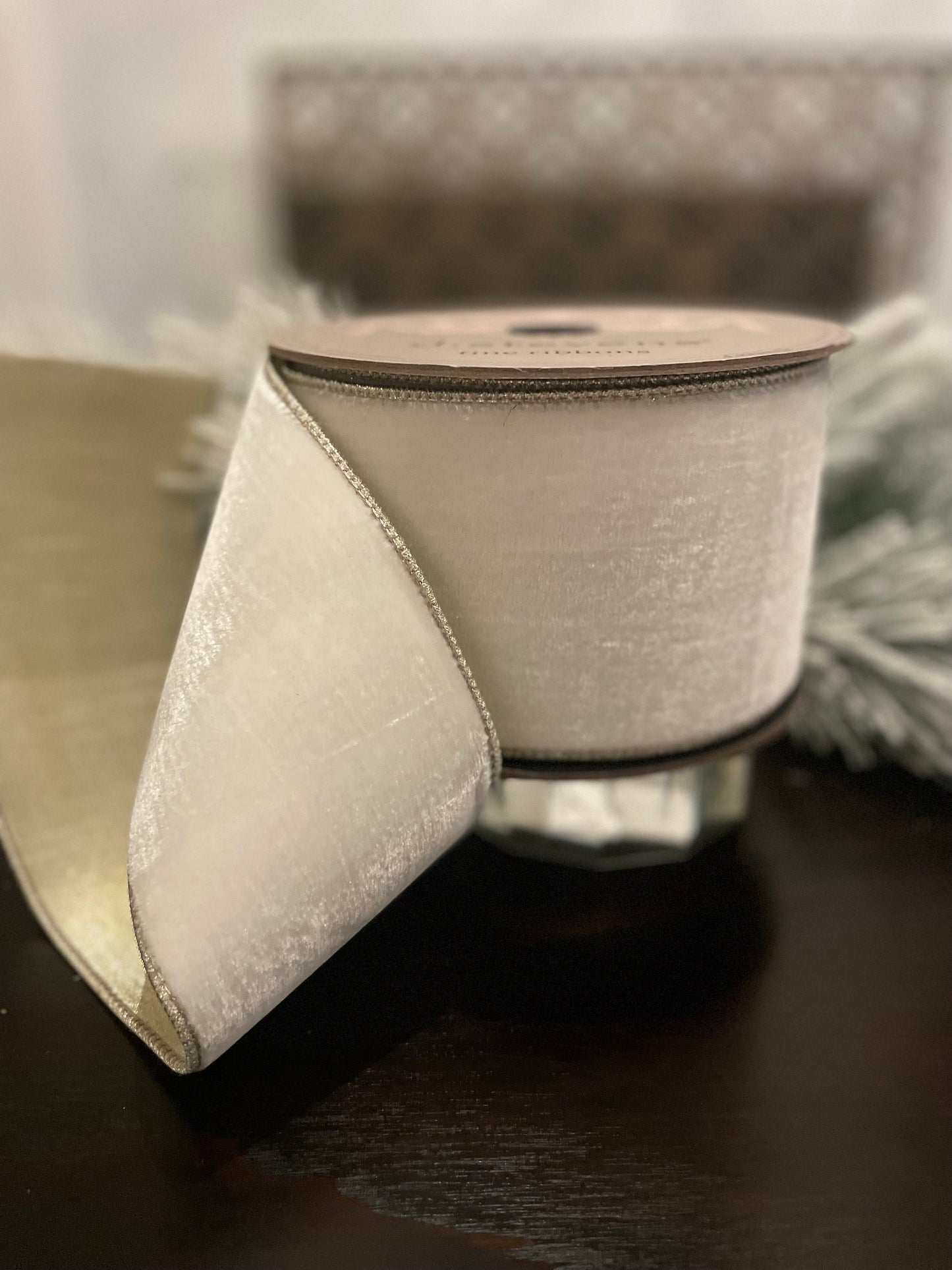 4” x 10 yds. Designer lush velvet winter white, metallic platinum back ribbon. Wired. D. Stevens.