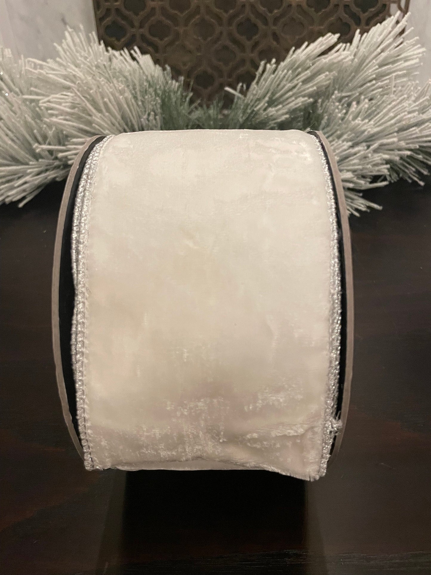 4”x 10 yds. Designer lush velvet winter white, metallic silver back ribbon. Wired. D. Stevens.