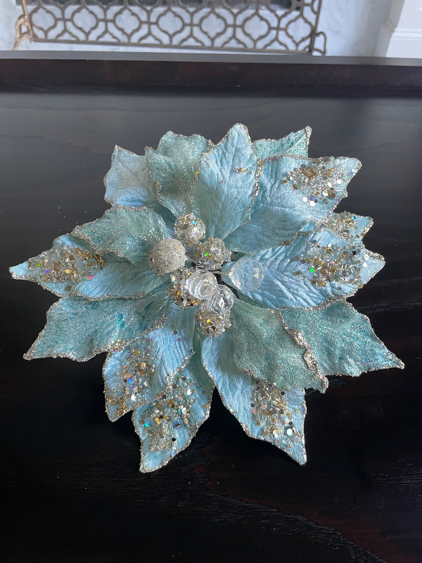 9.5” Poinsettia with clip soft blue, glitter and beaded 9.5” tip to tip.