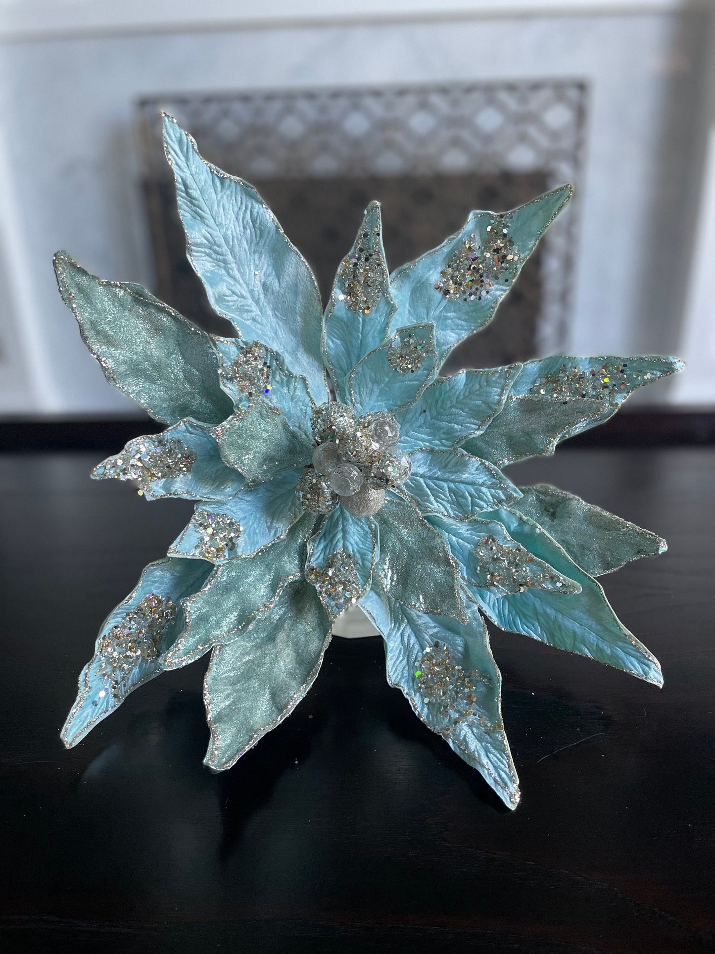 17.5” Clip Poinsettia beaded and glitter soft blue. 17.5” tip to tip.