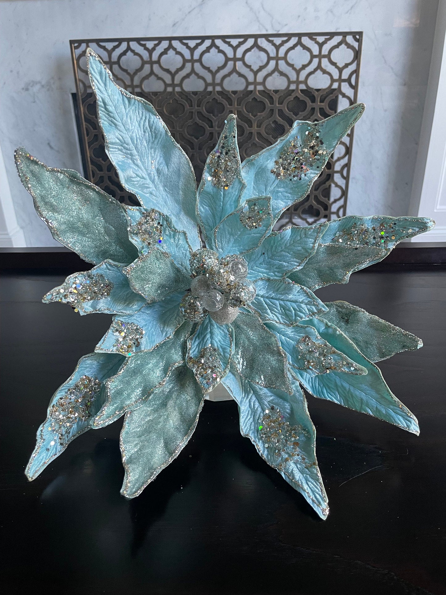 17.5” Clip Poinsettia beaded and glitter soft blue. 17.5” tip to tip.