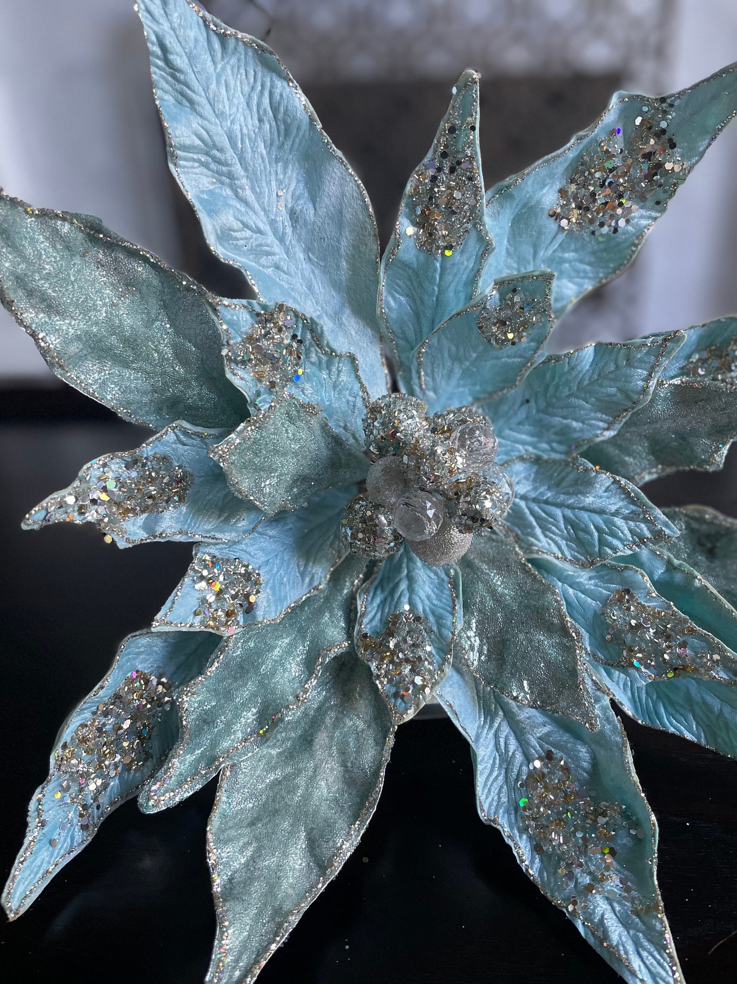 17.5” Clip Poinsettia beaded and glitter soft blue. 17.5” tip to tip.