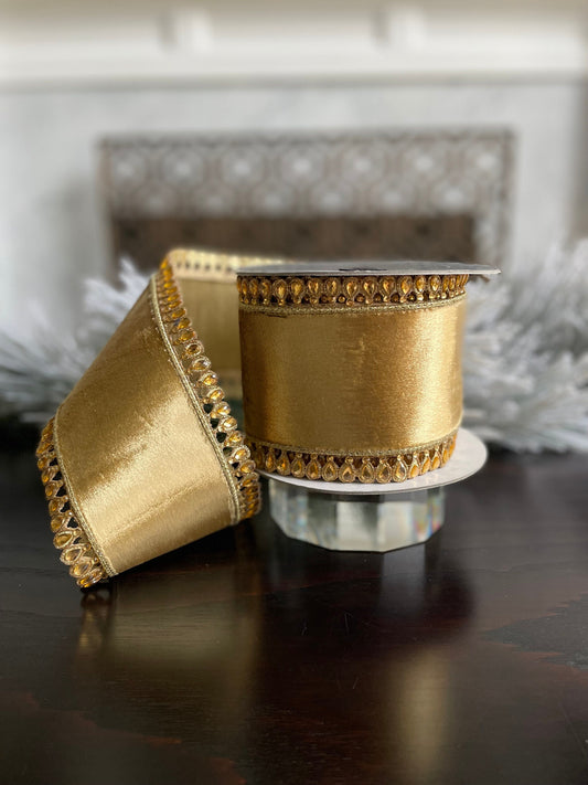 4” x 5 yds. Jewel plumes gold ribbon. Wired. Farrisilk.