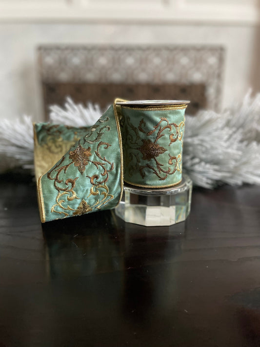 4” x 5 yds. Designer aqua and gold embroidered leaf filigree ribbon. Wired. Regency.