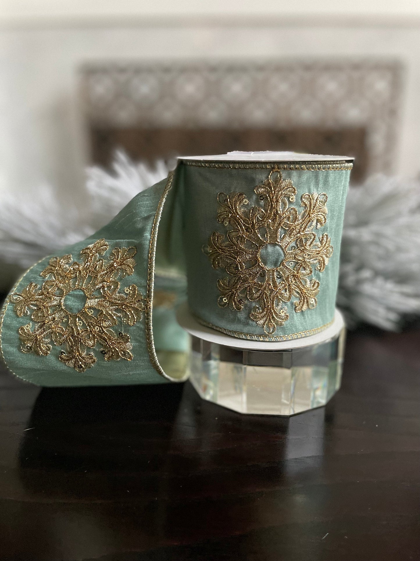 4” x 5 yds. Designer aqua and gold snowflake embroided dupion ribbon. Wired. Regency.
