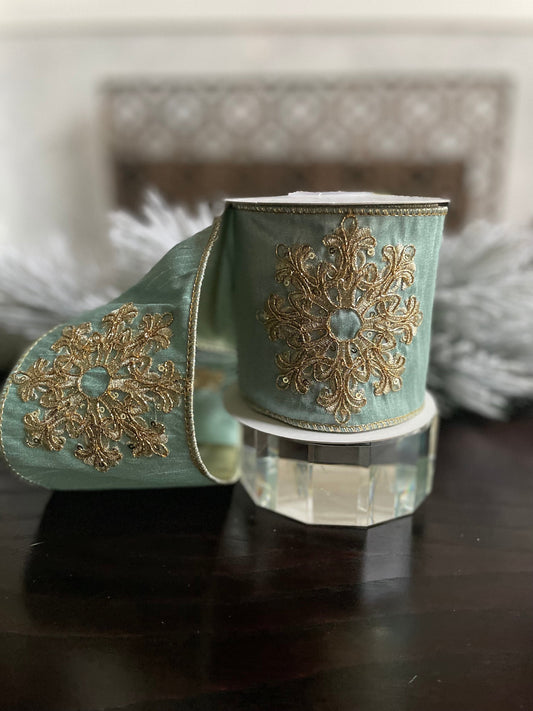 4” x 5 yds. Designer aqua and gold snowflake embroided dupion ribbon. Wired. Regency.