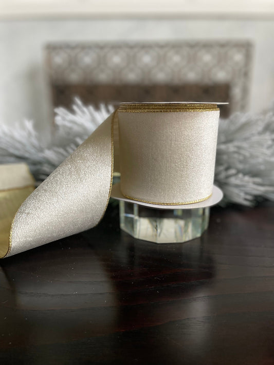 4” x 10 yds. White velvet and metallic gold back ribbon. Wired. Regency.