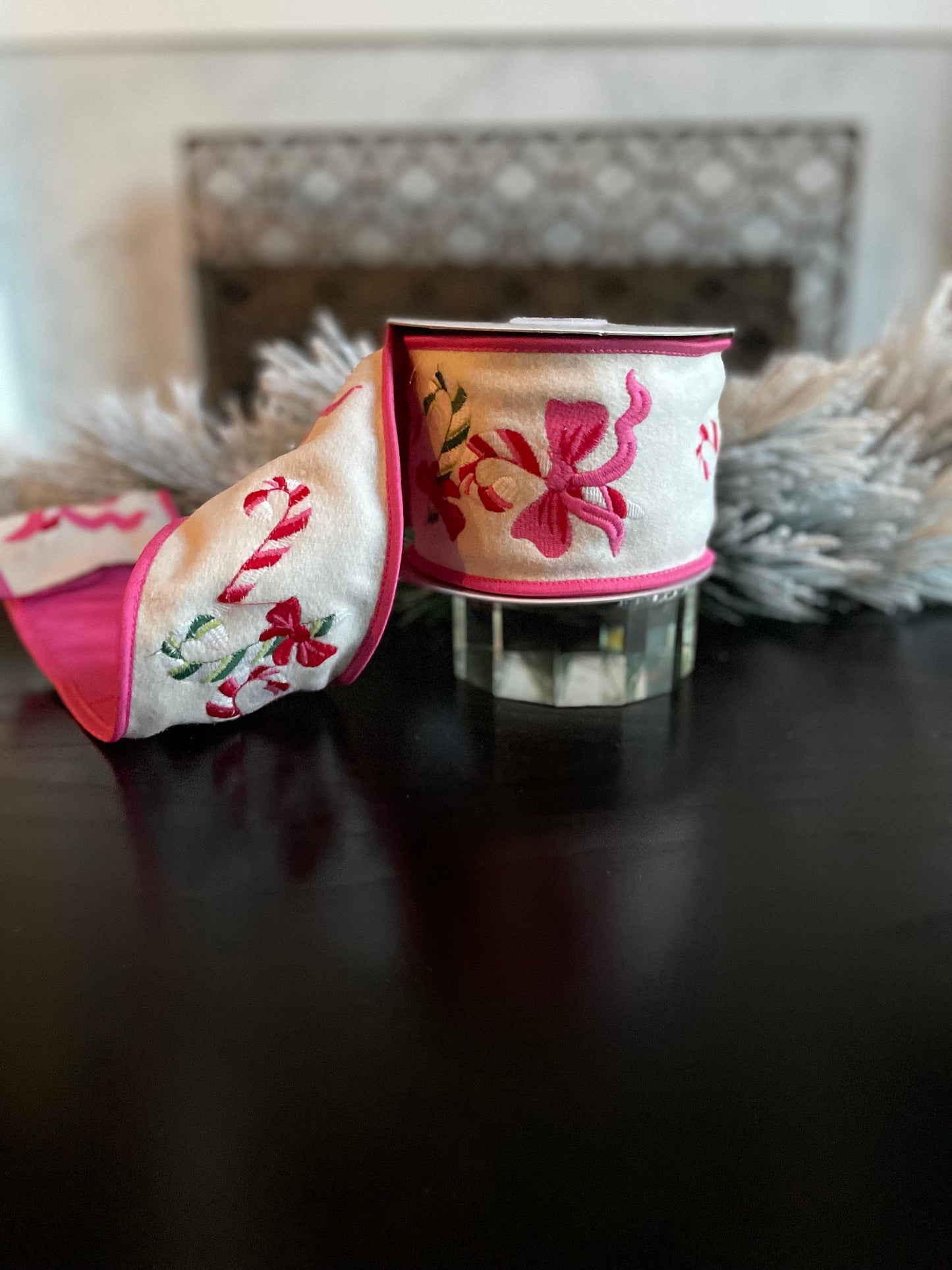 4” x 5 yds. Designer candy cane and bow embroidered wool felt ribbon. Pink and cream. Wired. Regency.