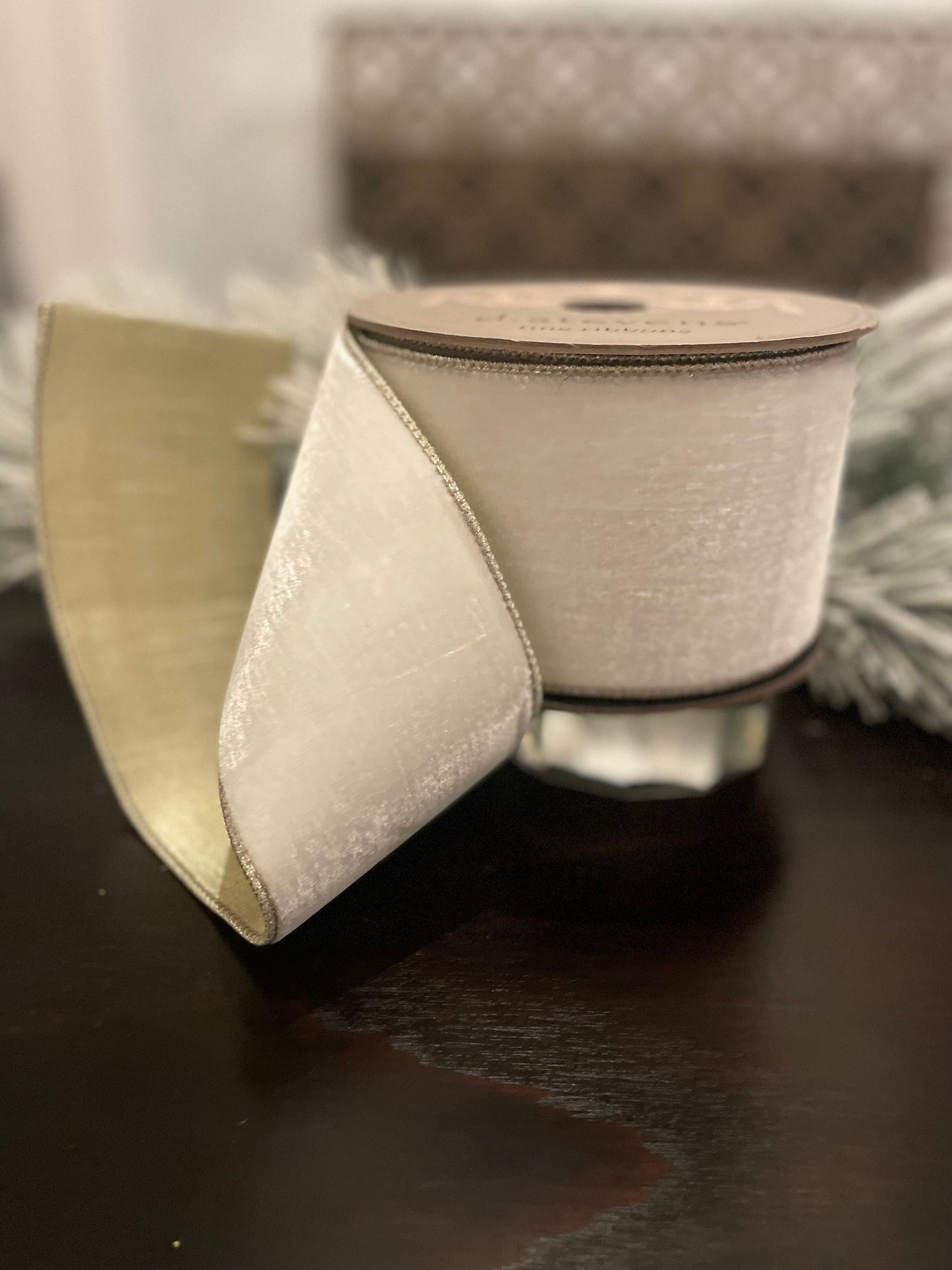 4” x 10 yds. Designer lush velvet winter white, metallic platinum back ribbon. Wired. D. Stevens.