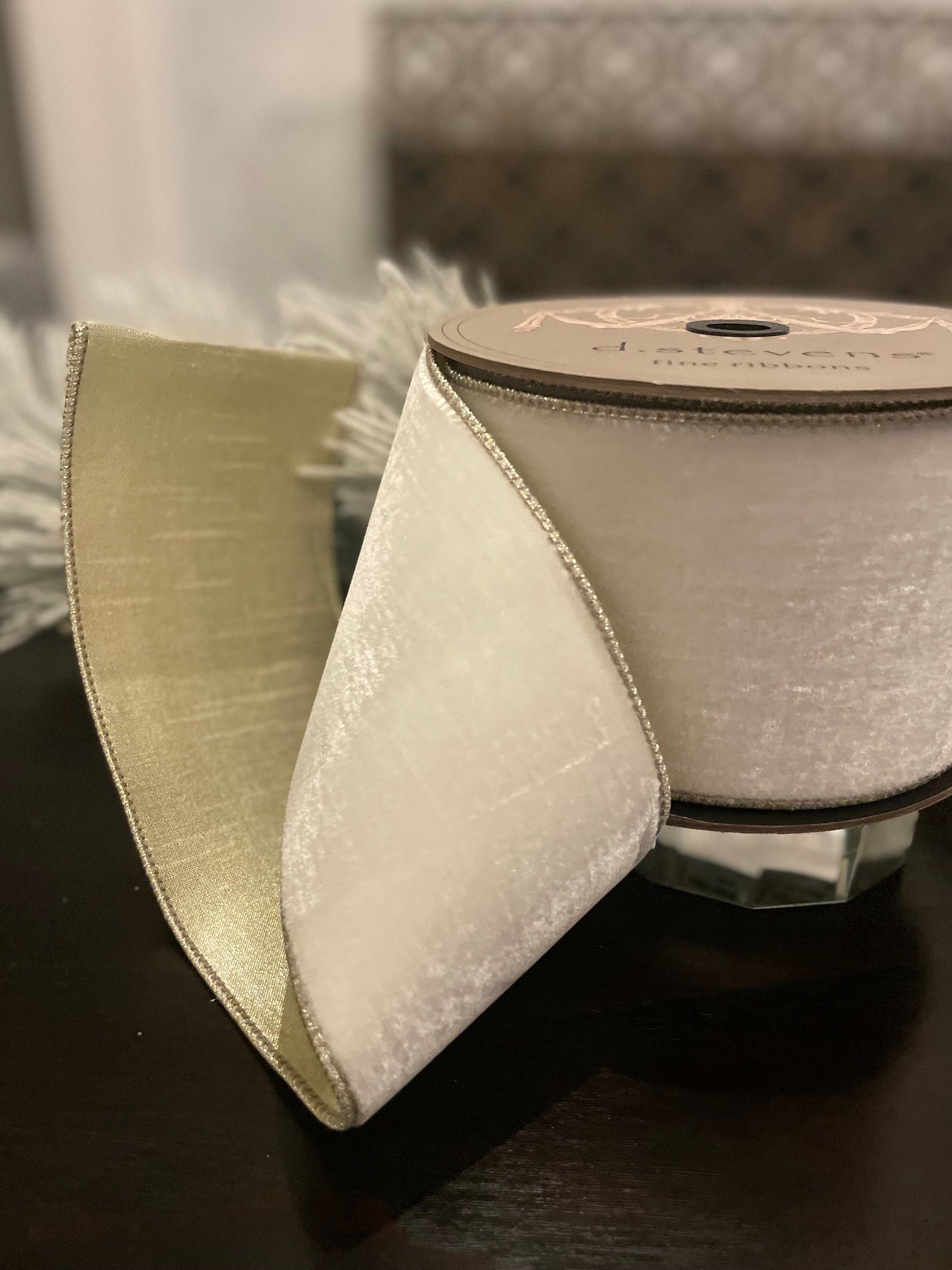 4” x 10 yds. Designer lush velvet winter white, metallic platinum back ribbon. Wired. D. Stevens.