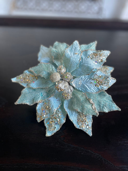 9.5” Poinsettia with clip soft blue, glitter and beaded 9.5” tip to tip.