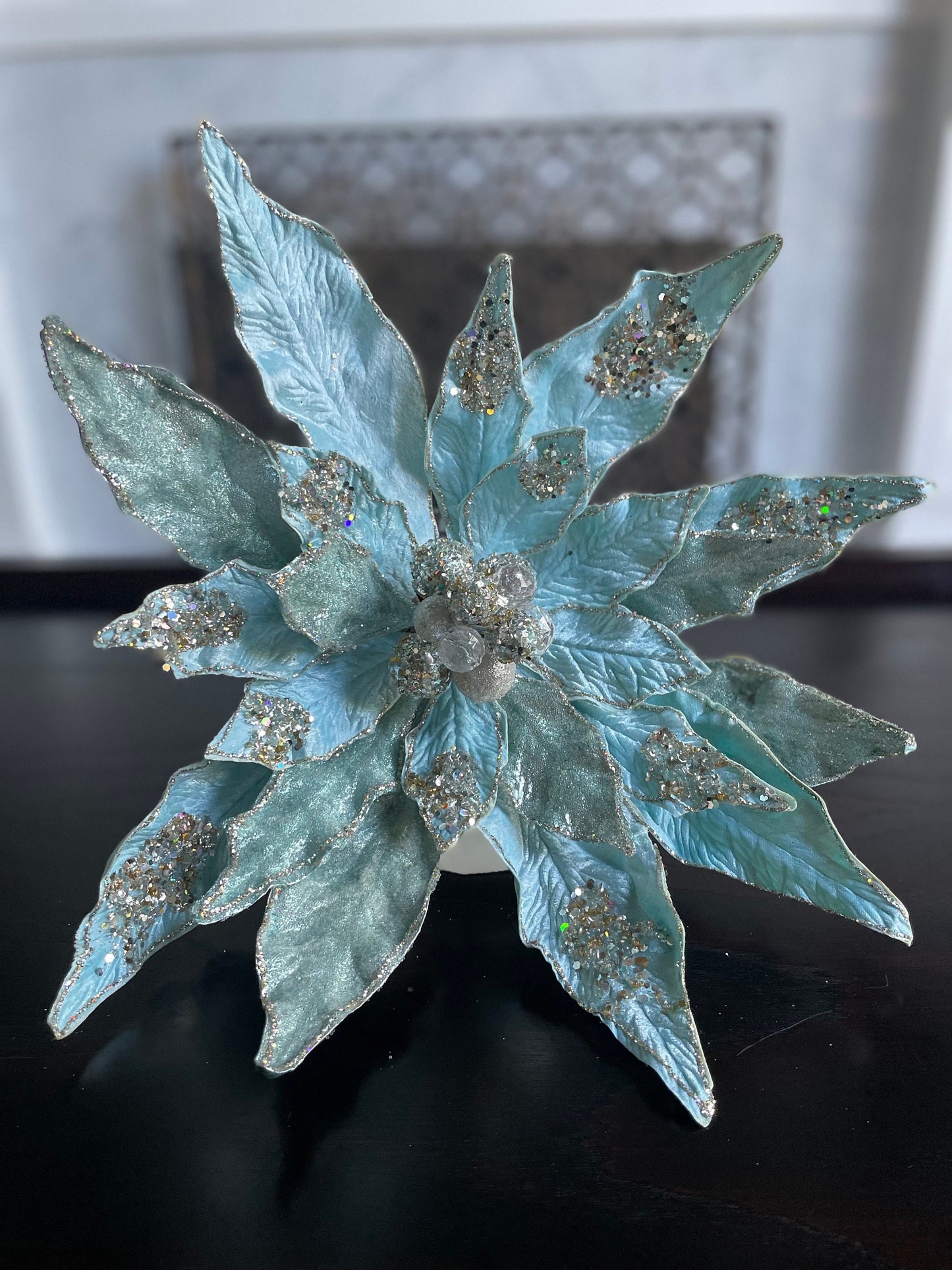 17.5” Clip Poinsettia beaded and glitter soft blue. 17.5” tip to tip.