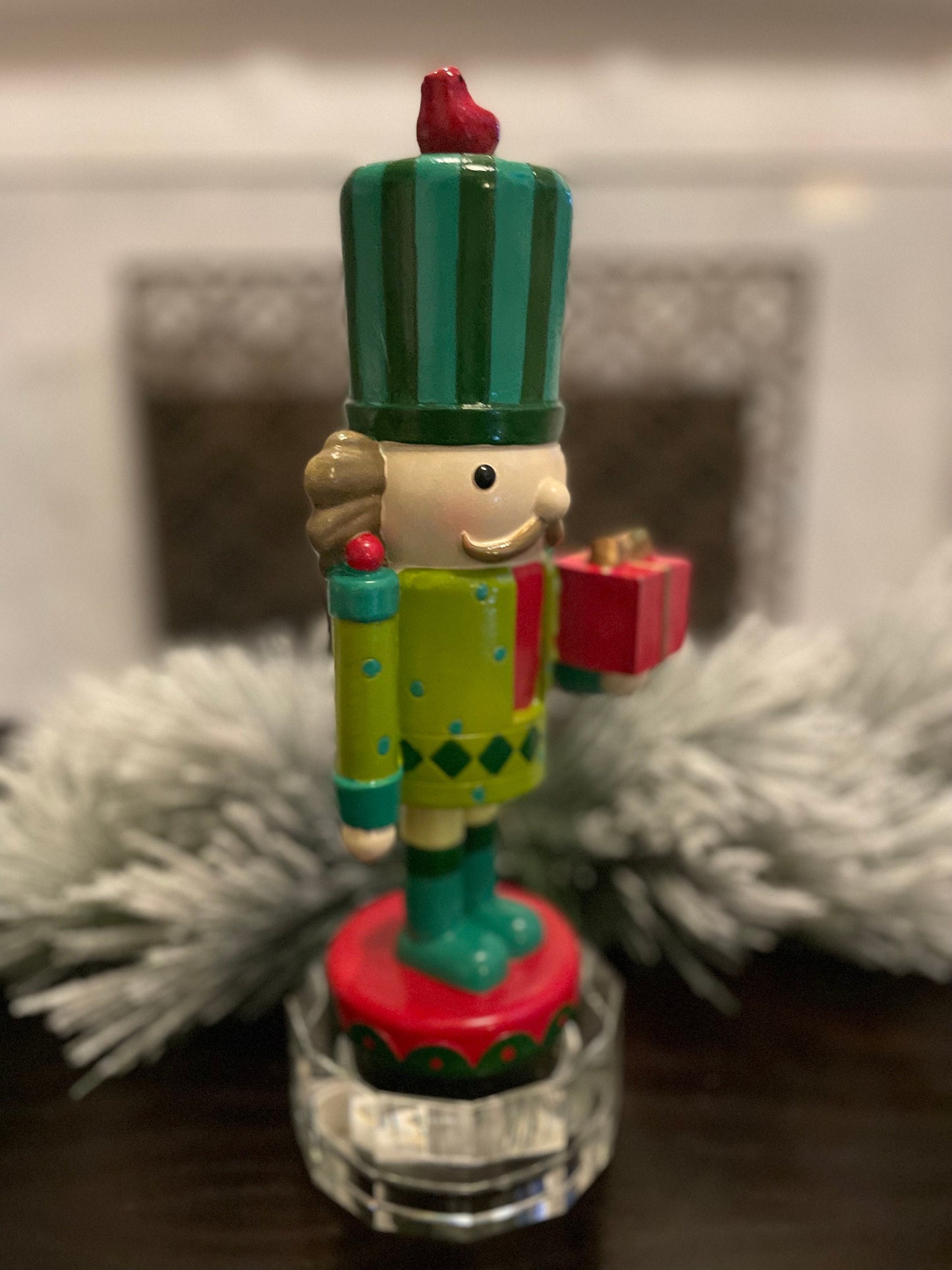 Nutcracker. 12” resin nutcracker with packages. Multi color.