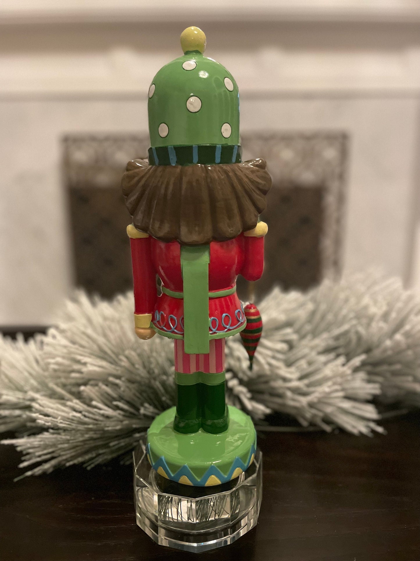 14” Resin nutcracker with ornament. Tabletop.