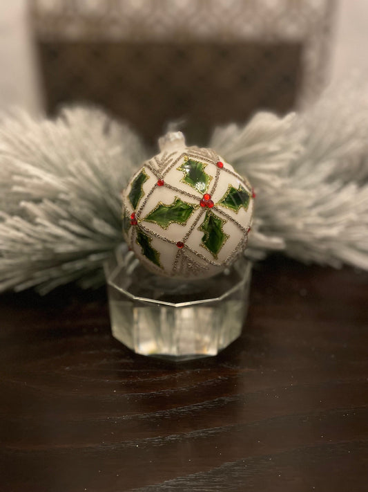 Set of 2. 4" glass holly jewel ball ornament.