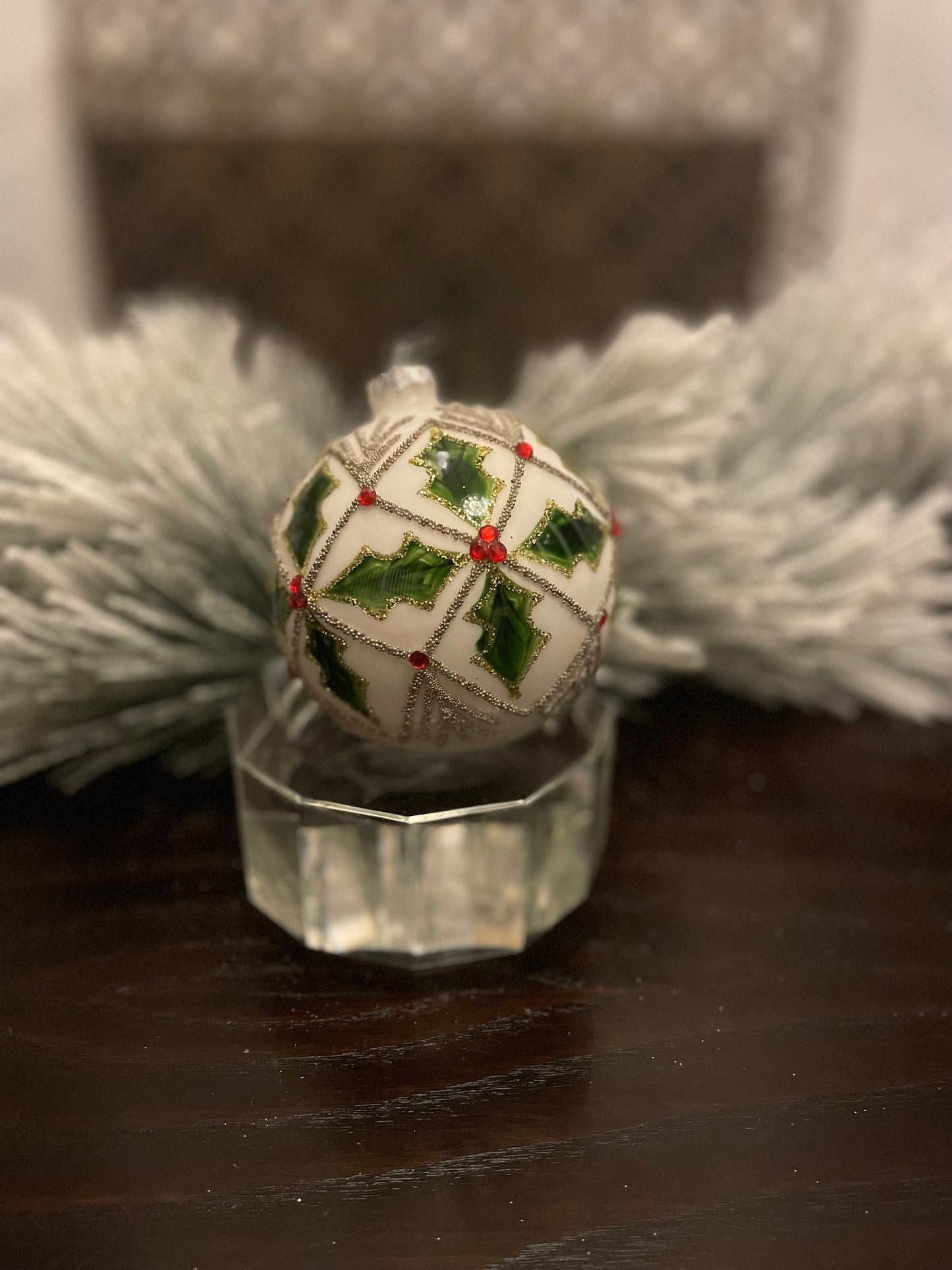 Set of 2. 4" glass holly jewel ball ornament.
