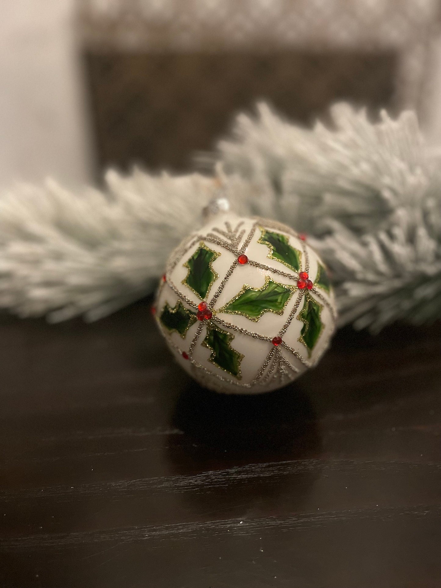 Set of 2. 4" glass holly jewel ball ornament.