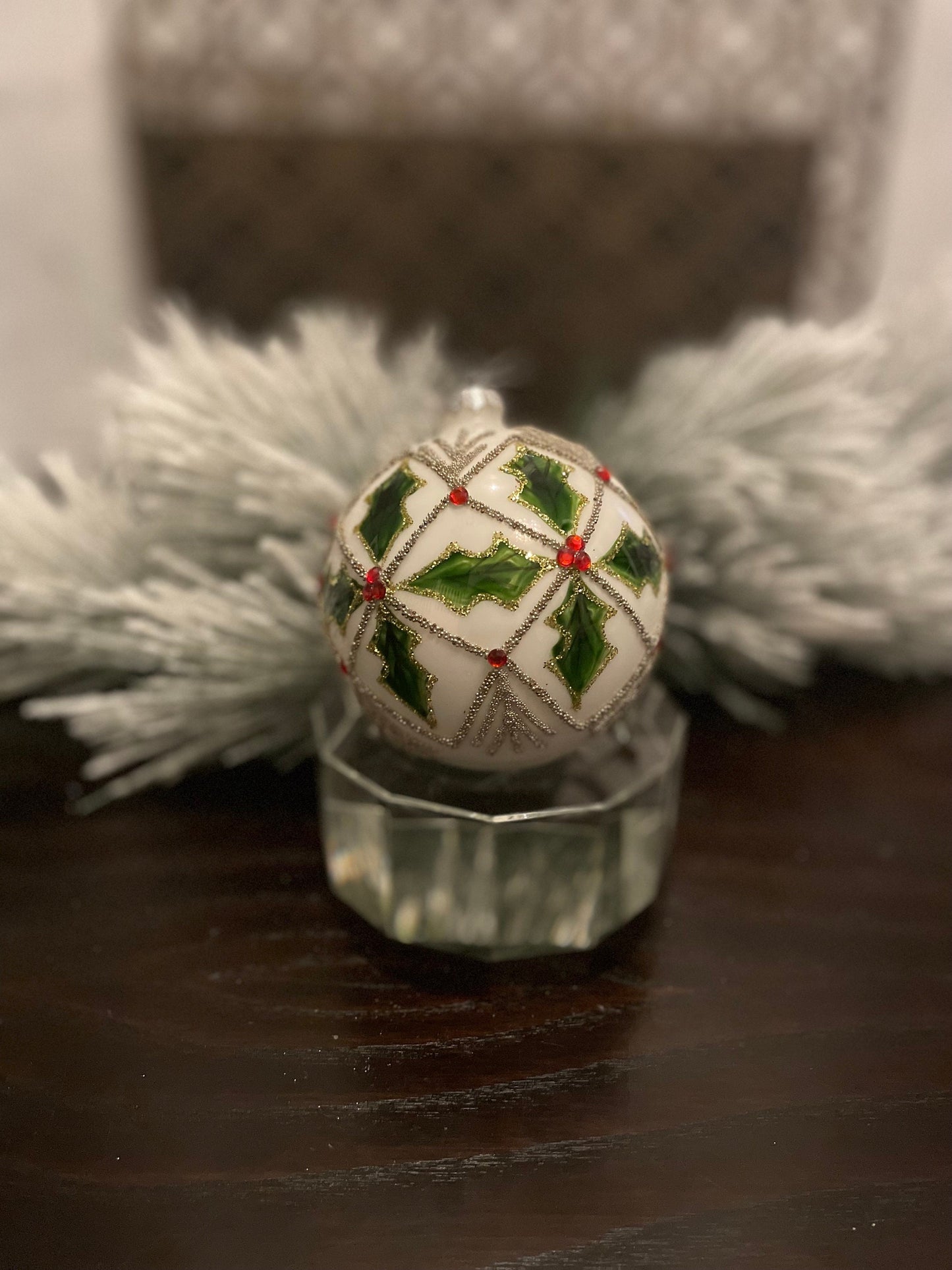 Set of 2. 4" glass holly jewel ball ornament.